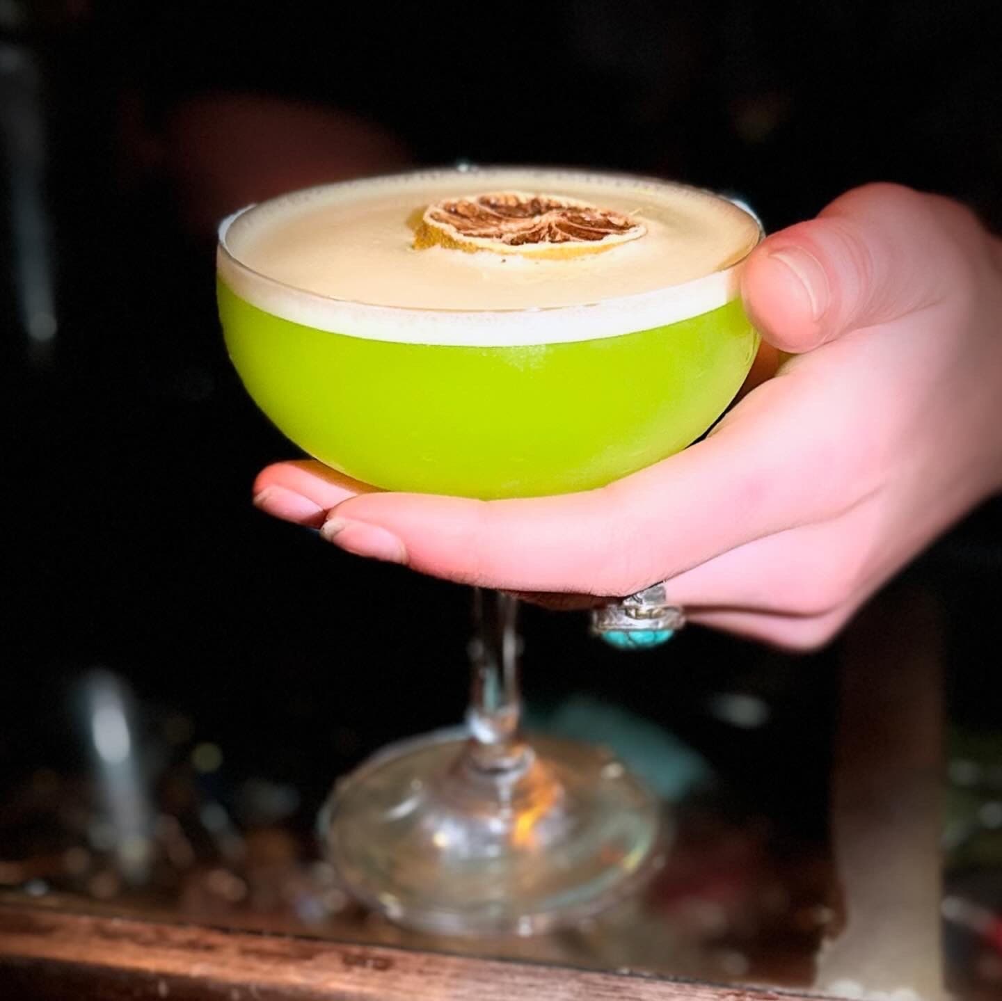 A house cocktail by candlelight